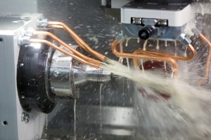 Grinding workpiece on cnc grinder machine with cooling emulsion